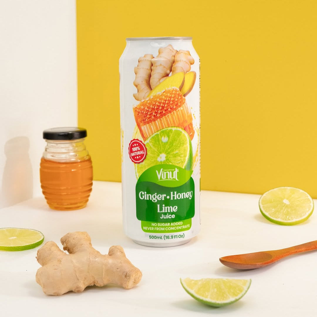 VINUT Ginger Honey Lime juice 16.9 oz can displayed with fresh ginger, honey and lime