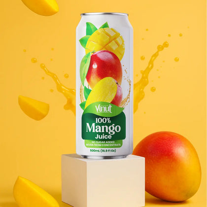 VINUT 100% mango juice can on table with fresh tropical fruit